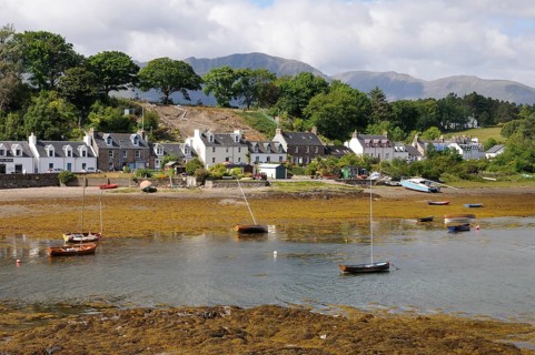 Boats grounded at low tide in a small fishing village