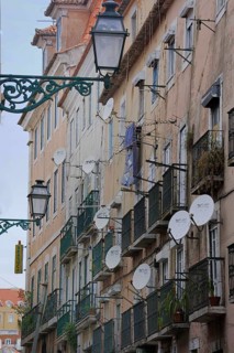 Typical facades with balconies and satellite dishes