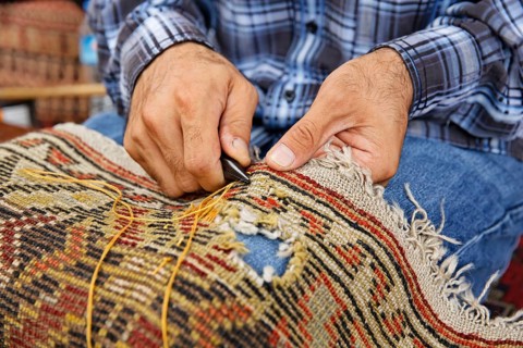 Man patching a carpet
