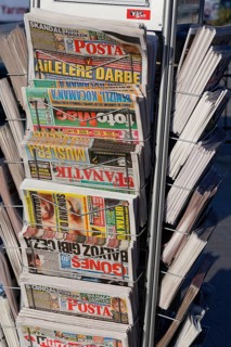 Daily newspapers in magazine racks