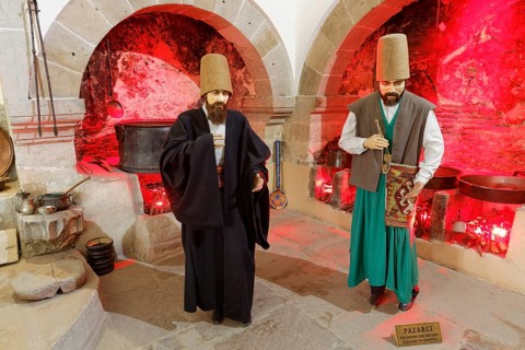 Life-size figures of dervishes in the bazaar