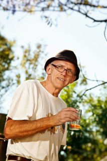 Man with freshly squeezed apple juice