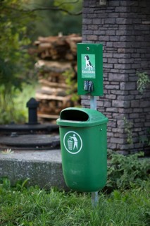 Garbage bin with organic dog waste bags in the Weissensee Nature Park
