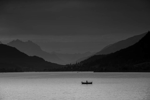 View over Weissensee lake towards Techendorf in the evening light
