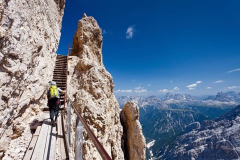 Hiker climbing Monte Cristallino mountain