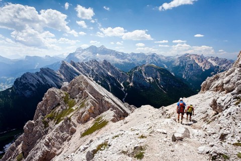 Hikers on their way down from the summit of Cristallino mountain