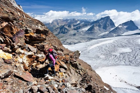 Mountain climber ascending Schneebiger Nock Mountain