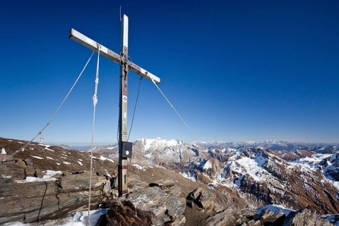 Summit cross on the summit of Wilden Kreuzspitze Mountain in the Pfunderer Mountains