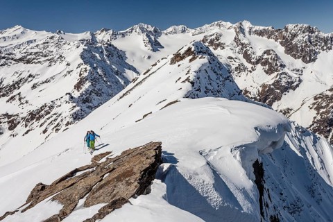 Ski walkers on the summit ridge with snowdrift