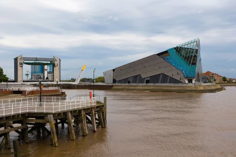 The Deep and The River Hull tidal barrier viewed from the west bank of the river Hull