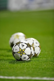 Three footballs