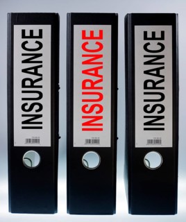 Three ring binders labelled 'INSURANCE'
