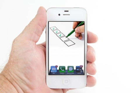 Boxes are ticked off on the display of a smartphone