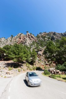 Car travelling on a mountain road near Estellencs