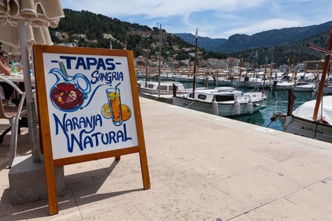 Menu board for tapas at a restaurant in Port de Sóller