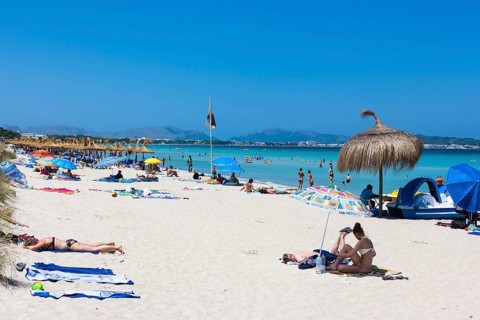 Sandy beach with tourists