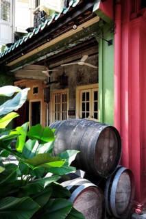 Wooden wine barrels in front of the Que Pasa bar
