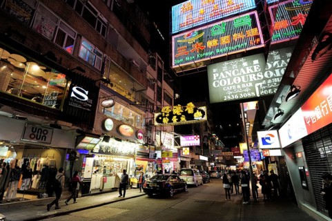 Neon signs on a street in Tsim Sha Tsui at night