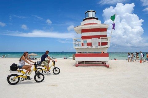 Couple riding electric bicycles