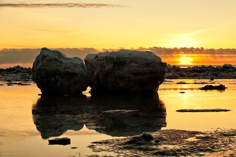 Sunset and stranded icebergs at low tide in Turnagain Arm