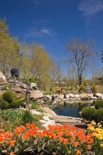 The ornamental pond in the Zen garden at springtime in the 'Route des Gerbes d'Angelica' garden in Mirabel
