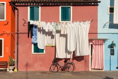 Street scene with laundry and bicycle