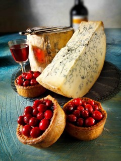 Traditional blue Stilton cheese with cranberry pork pie