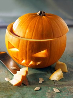 Pumpkin with a traditional carved Halloween face