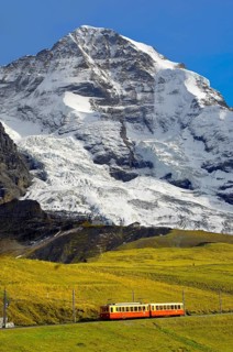 Junfraujoch funicular railway in front of the Moench from Kleine Scheidegg