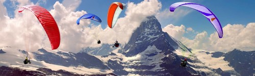 Paragliders over the Matterhorn mountain peak