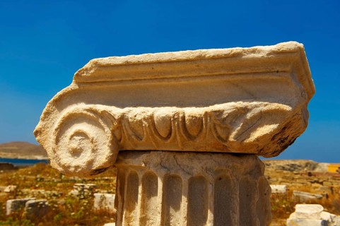 Delphic column capital of the ruins of the Greek city of Delos