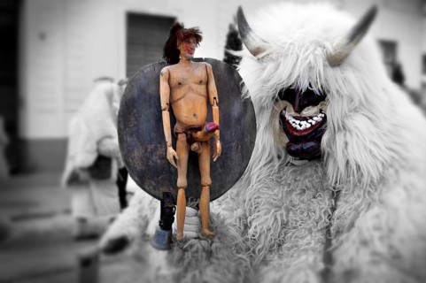 Buso with fertility figure on the Tuesday procession of the Busojaras Spring festival 2010