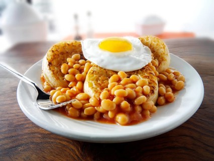 Baked beans on crumpets with fried egg on top