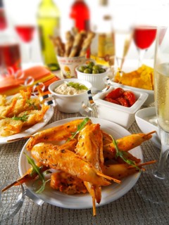 Party food with chicken satay and tapas