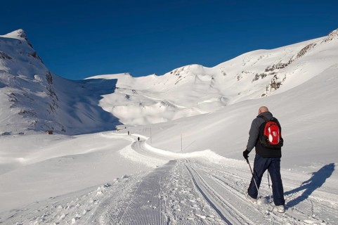 Walker in the snow in the mountains near Grindelwald First