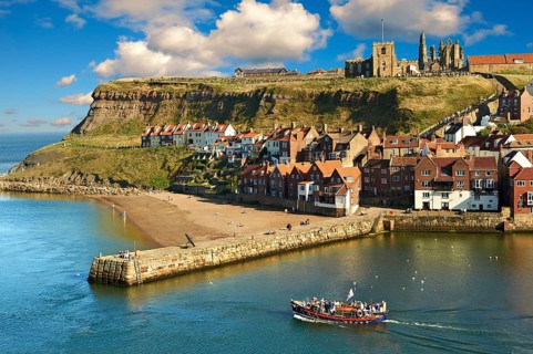 Whitby harbour with Whitby Abbey on the headland