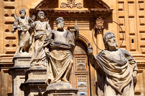 Sculptures in front of baroque Cathedral of Modica