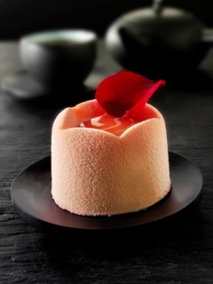 White chocolate cake with a sponge case and strawberry filling