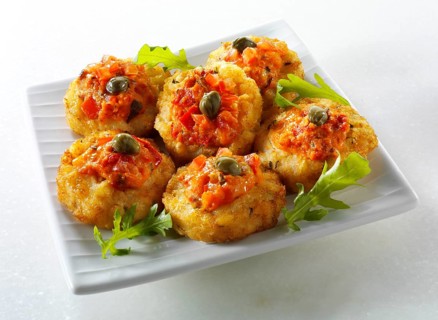Mini potato roesti topped with tomato salsa and capers