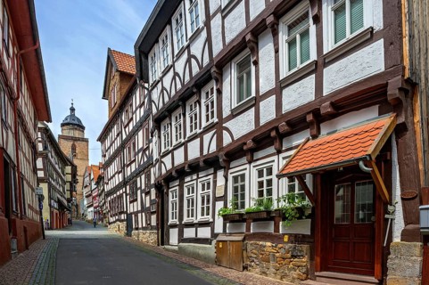 Alleyway with half-timbered houses and tower of Walpurgis Church