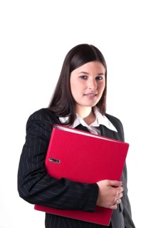 Businesswoman holding a red folder in her arm