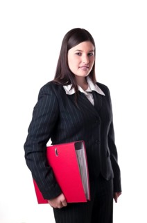 Businesswoman holding a red folder under her arm
