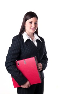 Businesswoman holding a red folder under her arm
