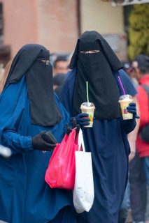 Veiled women on a shopping spree
