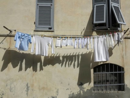 Laundry hanging on a clothesline on a facade