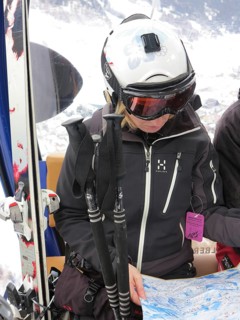 Skier studied card during a gondola ride in St. Anton am Arlberg
