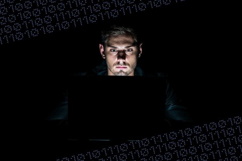 Young man sitting at a computer
