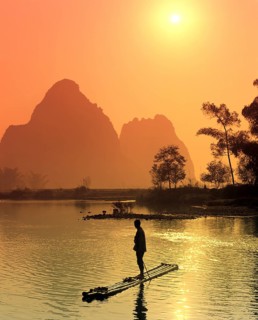 Fisherman on a bamboo raft on the Li Jiang River
