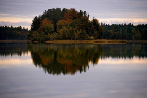 Autumnal island with reflection Lake Ostersee
