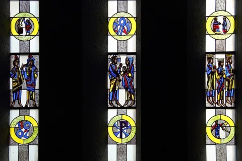 Stained glass window with Christian motifs